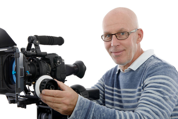 Handsome man with camcorder on white background - Photo, Image