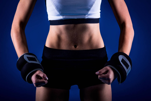 athletic girl on blue background - Фото, изображение