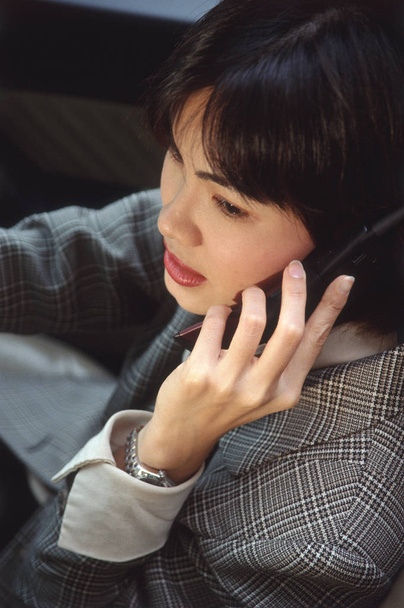 Female talking on cellular phone  - Фото, изображение