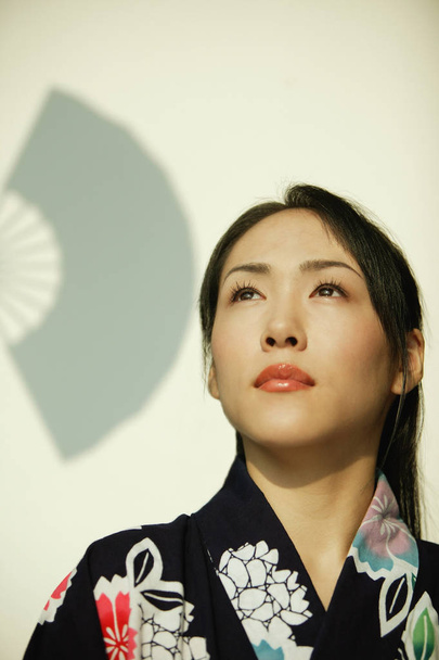 Young woman wearing a kimono - Foto, Imagem