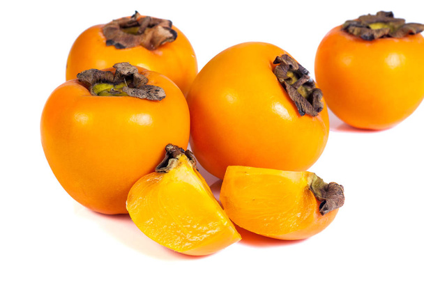 Na białym tle owoce persimmons - Zdjęcie, obraz
