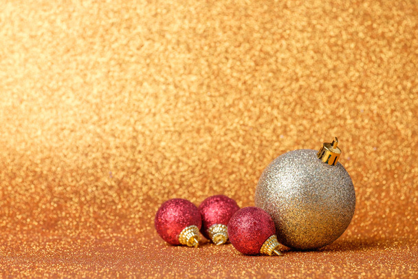 Christmas decorations on a glitter background - Fotografie, Obrázek