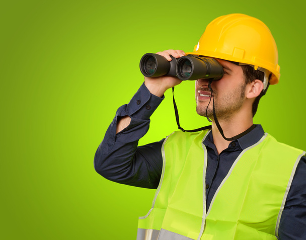 A Young Engineer Looking Through Binoculars - Foto, imagen
