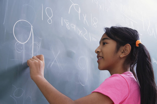 young girl at chalkboard  - Photo, Image