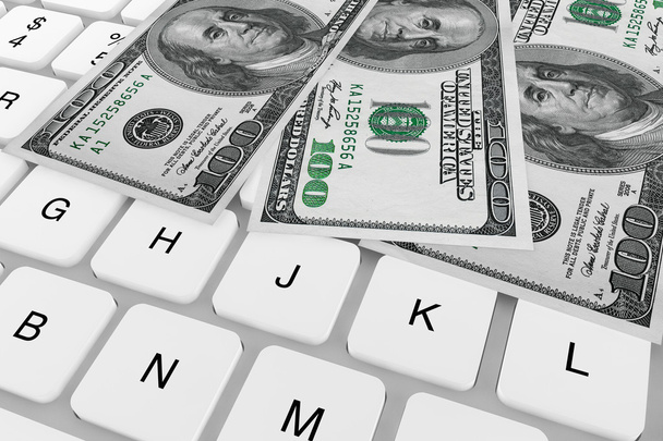 Billetes de dólares y teclado informático
 - Foto, Imagen