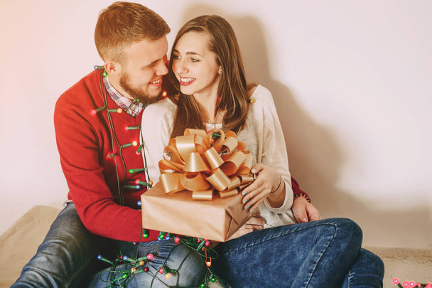 loving couple decorating Christmas tree - Valokuva, kuva