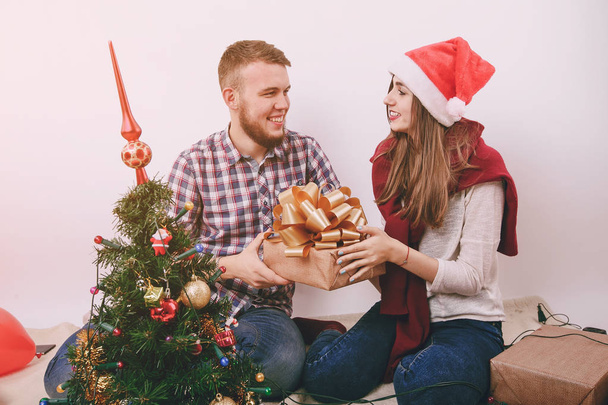 loving couple decorating Christmas tree - Fotografie, Obrázek