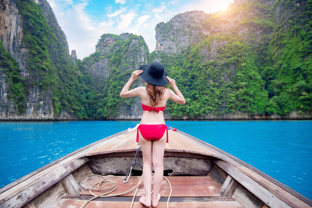 Beautiful girl in red bikini on boat. - Valokuva, kuva