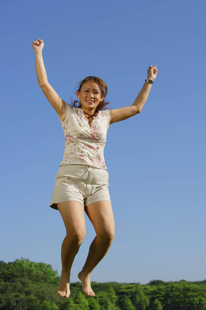 woman jumping on nature - Фото, зображення