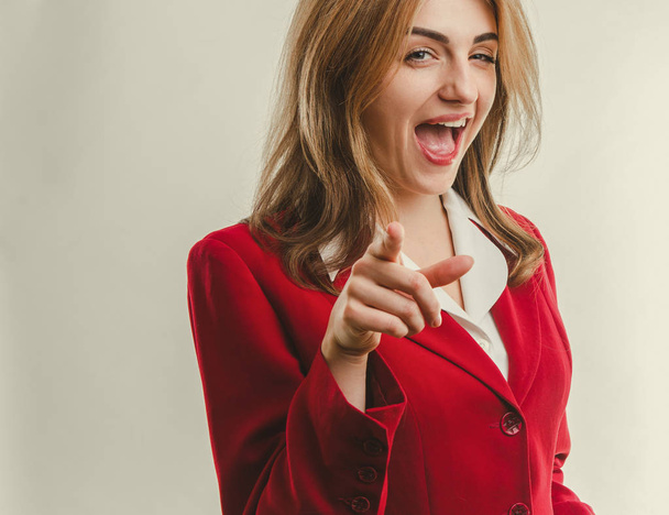 business lady in red jacket pointing finger forward - Photo, Image