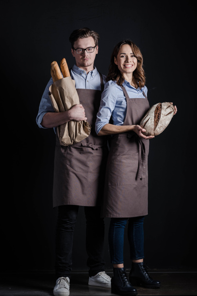 Bakers holding bread - Photo, Image