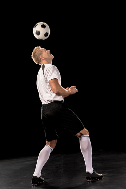 Soccer player with ball  - Фото, изображение