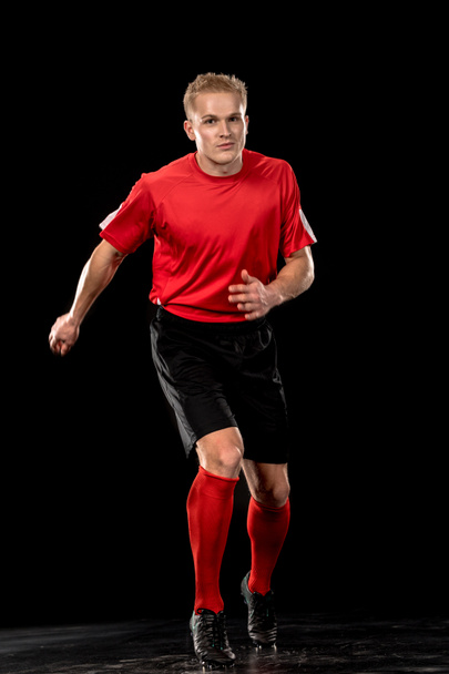 Jugador de fútbol en uniforme
 - Foto, Imagen