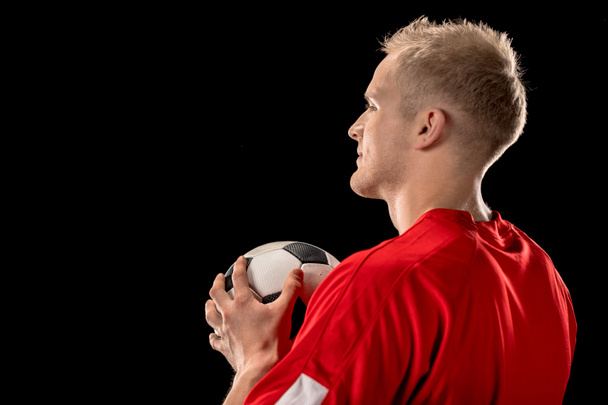 Soccer player holding ball - Zdjęcie, obraz