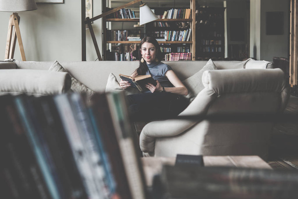 Woman enjoys reading  - Foto, immagini