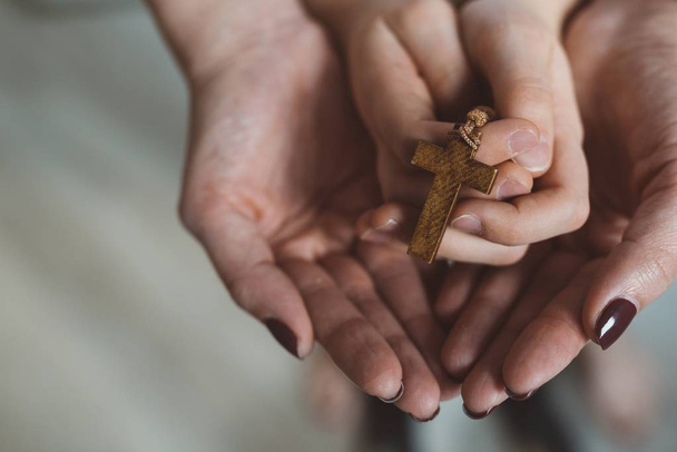 Family prayer with wooden rosary - Foto, Bild