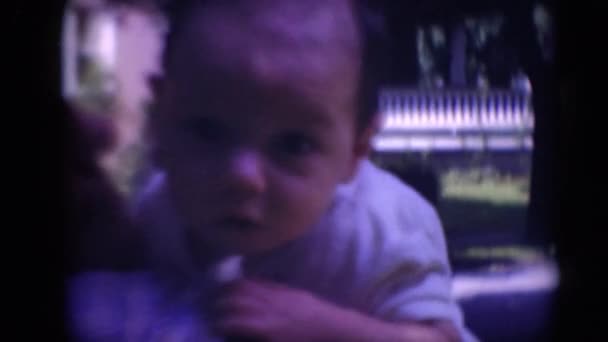 Woman holding infant baby - Filmagem, Vídeo