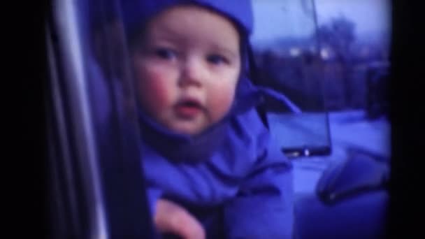 Boy looking though car window - Video, Çekim