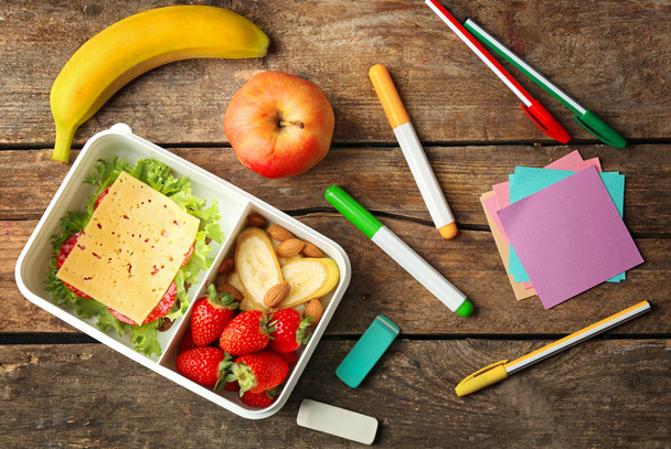Lunch box with food and stationery - Foto, Imagen