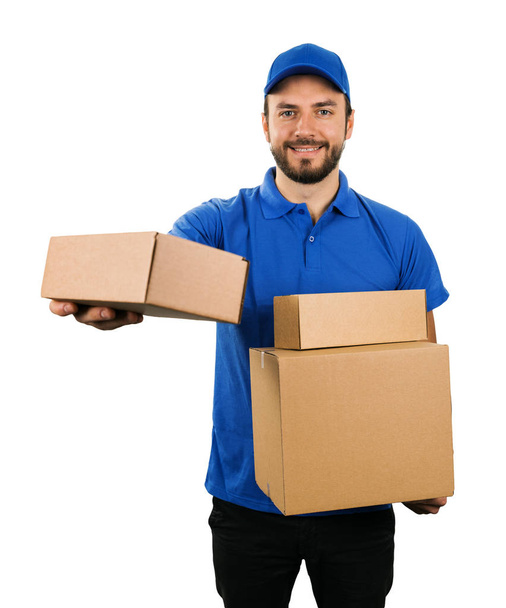 delivery courier giving cardboard shipping box. isolated on white - Foto, immagini