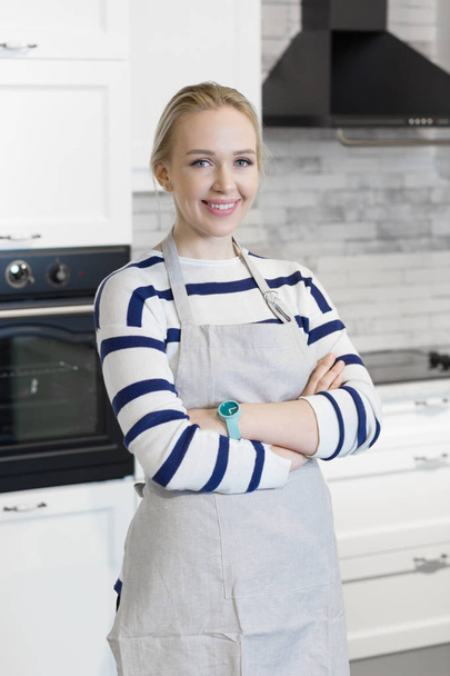 Young woman in the kitchen - Photo, image