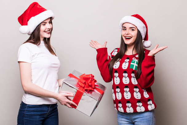 Two teenegers girls in santa hat  - Photo, Image