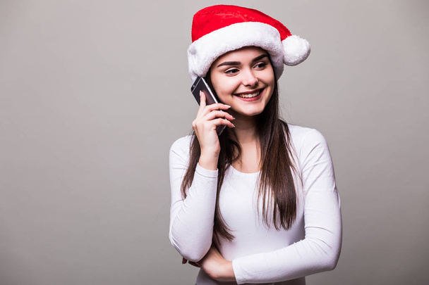 female girl model wear santa hat speak on phone - Foto, imagen