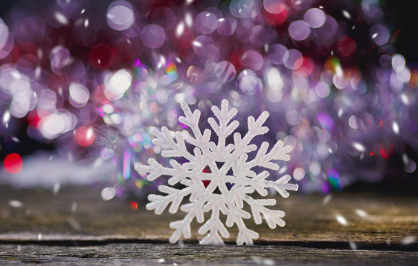 snowflakes on a wooden background. - Φωτογραφία, εικόνα