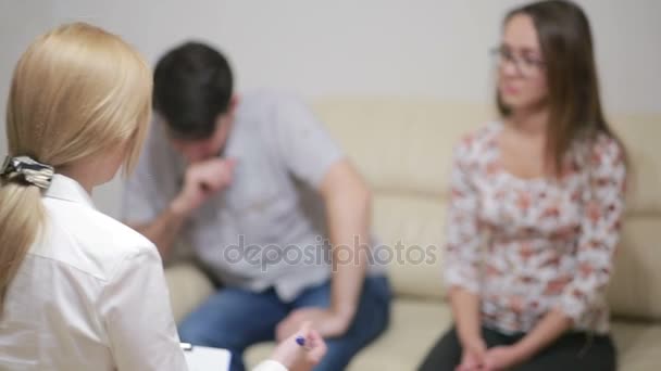 Female psychologist helping worried young couple. family therapy - Footage, Video
