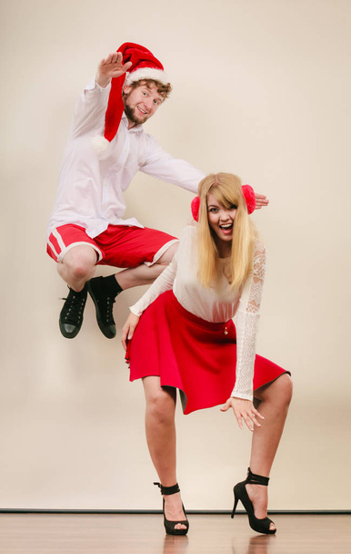Happy active couple dancing and jumping. - Φωτογραφία, εικόνα
