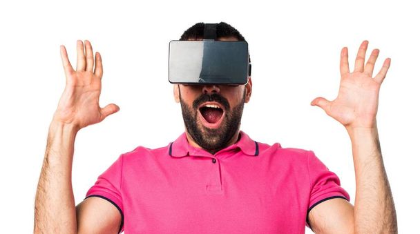 Man with colorful clothes using VR glasses - Foto, immagini