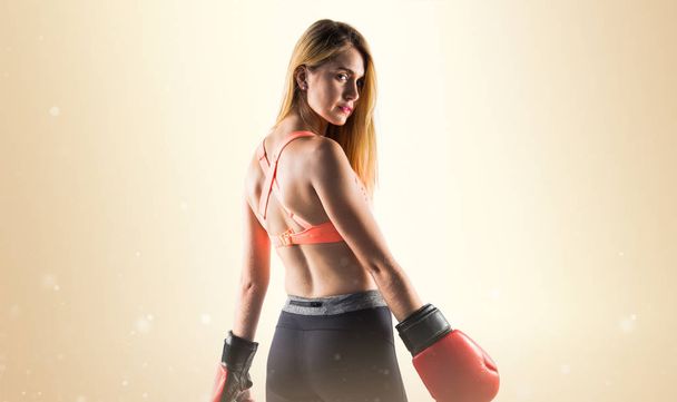 Blonde girl with boxing gloves - Φωτογραφία, εικόνα