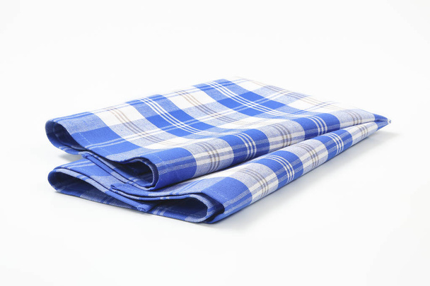 blauwe en witte schotelhanddoek - Foto, afbeelding