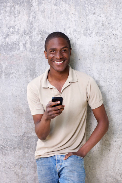 Guy laughing with mobile phone - Φωτογραφία, εικόνα