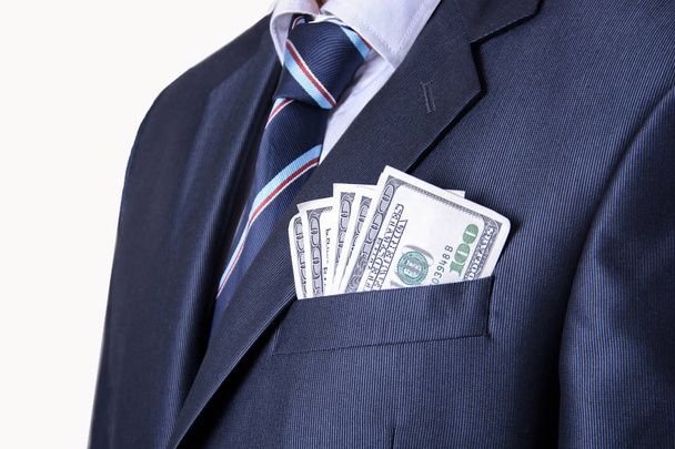 Деньги в кармане делового костюма
 - Фото, изображение