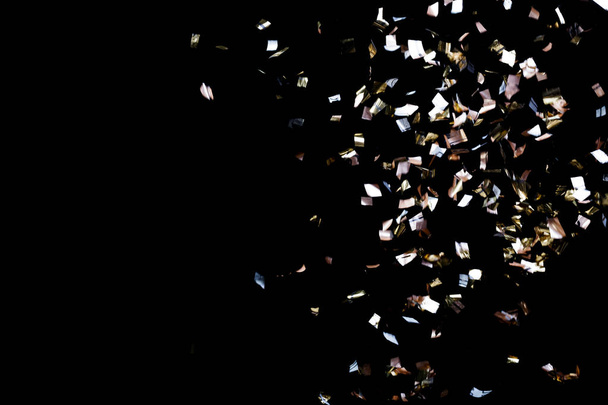 Golden confetti on black background - Φωτογραφία, εικόνα