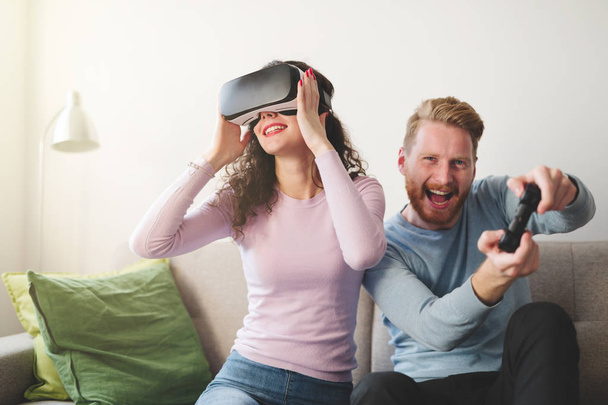 Couple having fun playing with VR - 写真・画像