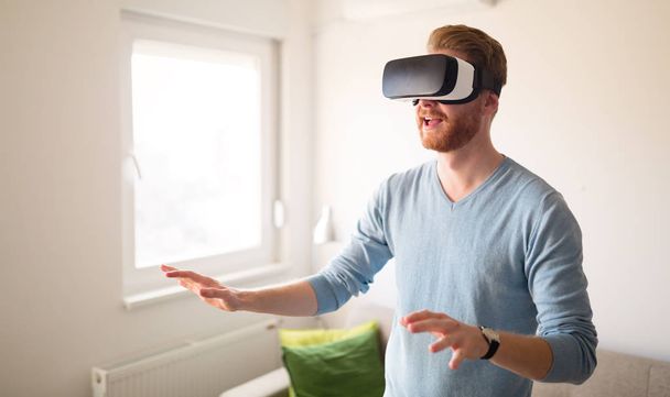 Man wearing future technology VR glasses - Фото, изображение