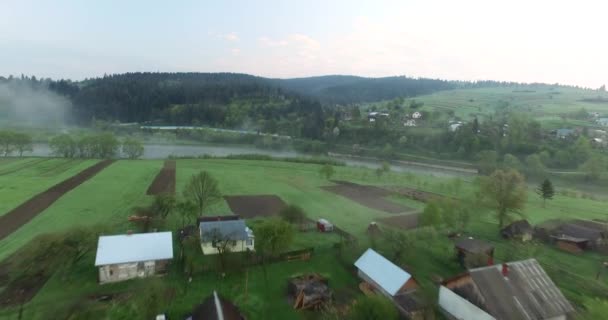 Picturesque location on the river near the hill. Aerial view - Video