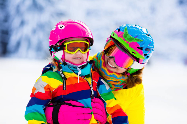 Family ski and snow fun in winter mountains - Photo, Image