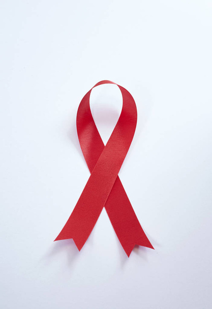 Red ribbon aids awareness - Фото, зображення