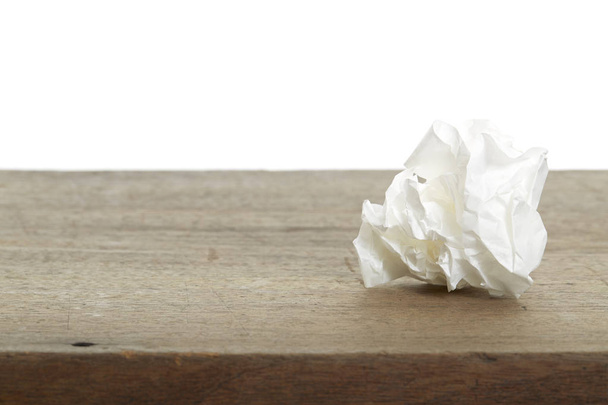 White Crumple paper ball on old wood desk - Φωτογραφία, εικόνα