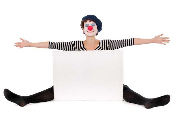 Cheerful clown woman seated on floor - Photo, Image
