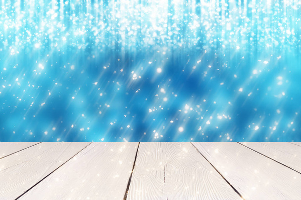 Karácsonyi absztrakt kék háttér arany kerek bokeh vagy kör a csillogó fények és fehér asztal. Használja a kijelző vagy a montázs a termékek - Fotó, kép