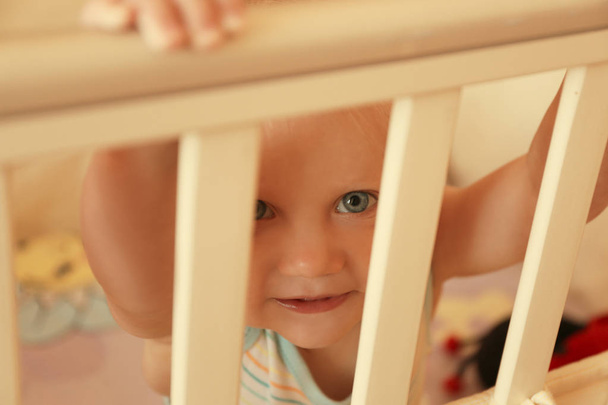 Little baby boy in crib indoors - Foto, Imagem