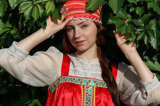Slav in traditional dress ivy wall tree - Photo, Image