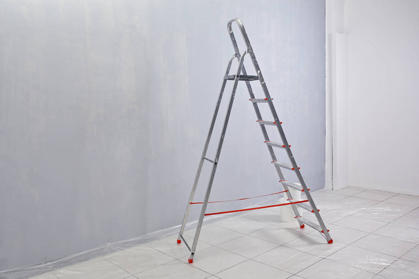 Ladder standing in room - Φωτογραφία, εικόνα