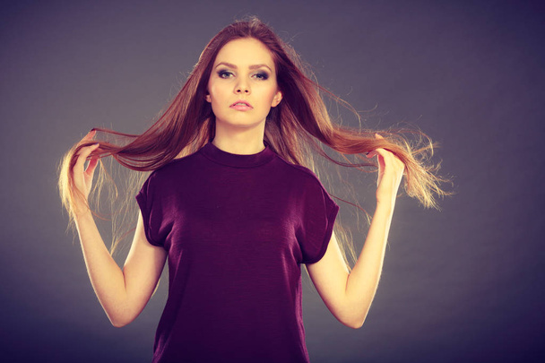 Attractive brunette woman with windblown hair - Foto, Imagen
