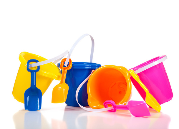 Row of colorful beach buckets or pails - Fotoğraf, Görsel