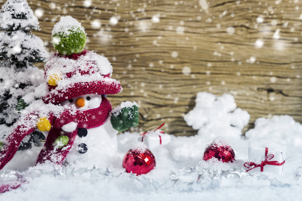 Christmas decoration happy snowman standing in winter - Foto, Bild